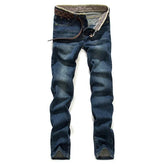 Men’s slim jeans with a faded blue denim look, perfect for stylish and comfortable wear
